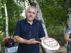 Dad holding his beautiful cake. Says, "Buon Compleanno, Maurizio"